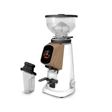 A coffee grinder with the lid open and a cup on top.