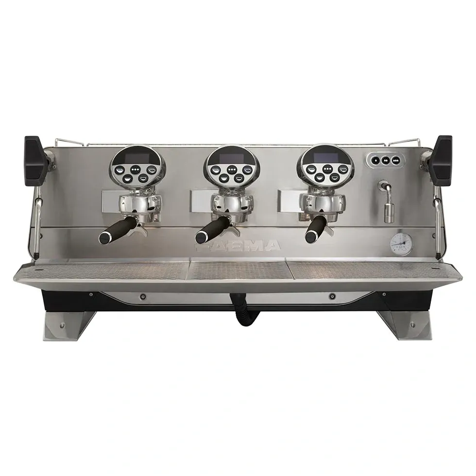 A silver coffee machine with three valves on the front.