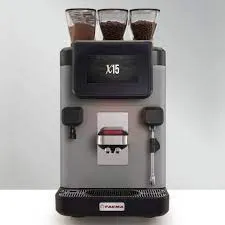 A coffee machine with three cups on top of it.